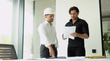 Two civil engineer handshake after mega project done
