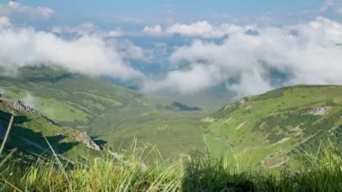 Clouds rolling over the mountain. Mysterious timelapse
