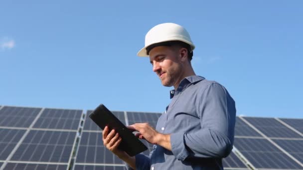 Engineer Solar Photovoltaic Panels Station Checks Tablet Computer — Video Stock