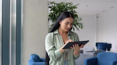 Freelance business women using tablet working call video conference with customer in workplace at cafe