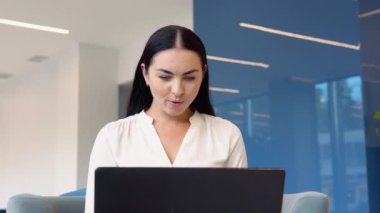 Amazed female professional winner feeling happy receiving new job opportunity, reward bonus, celebrates financial market growth concept. Excited business woman checking email reading great news on