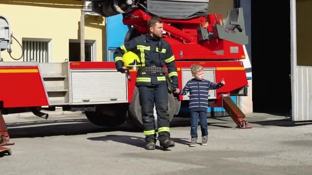 Little Boy Walk Firefighter Protective Uniform Fire Station — Stock Video