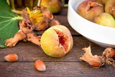 Organic fig and hazelnut on table, healthy vegetarian food