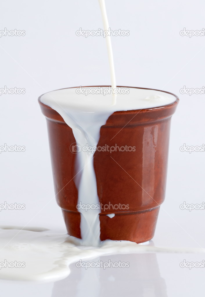 Milk poured from a clay cup