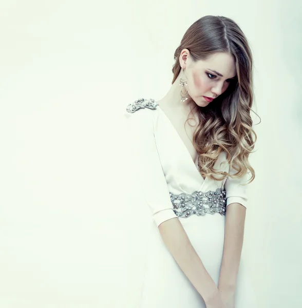 Fashion portrait of a sensual girl in a white dress — Stock Photo, Image