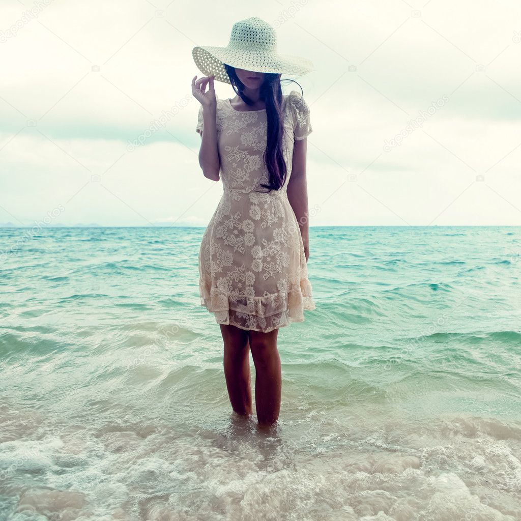 Fashion portrait of a girl on the sea