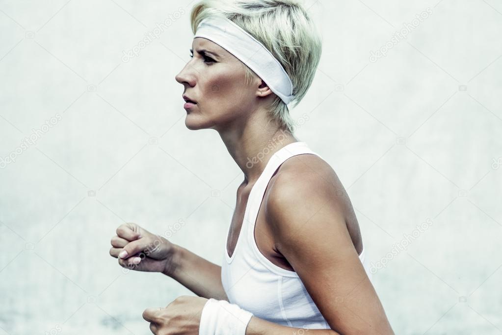 portrait of a young athletic girl running