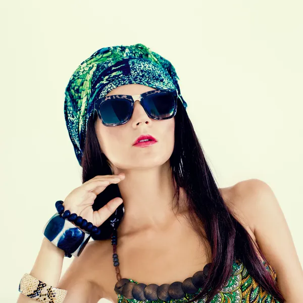 Fashion portrait of a girl in a stylish scarf — Stock Photo, Image