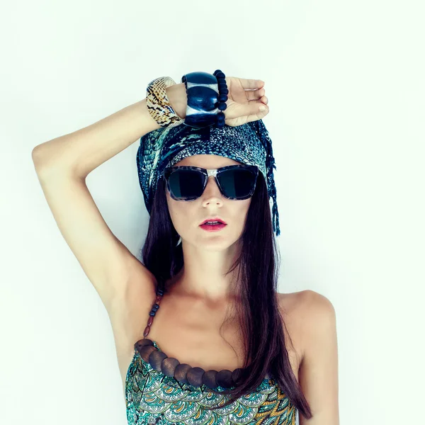 Fashion portrait of a girl in a stylish scarf — Stock Photo, Image