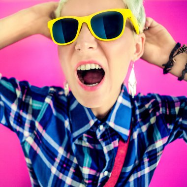 stylish girl shouts on a bright background