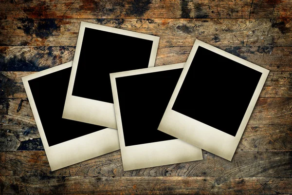 Blank film frames on a wood background — Stock Photo, Image