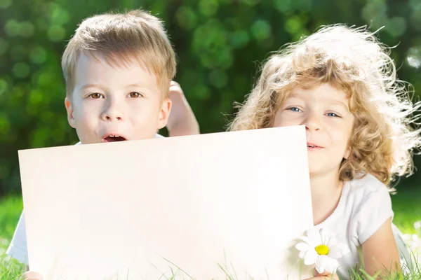 Children with paper blank — Stock Photo, Image