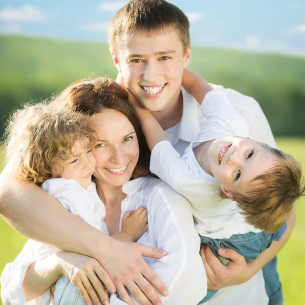 Happy family outdoors Stock Picture