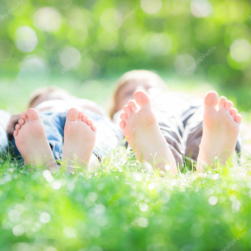 Family lying on grass