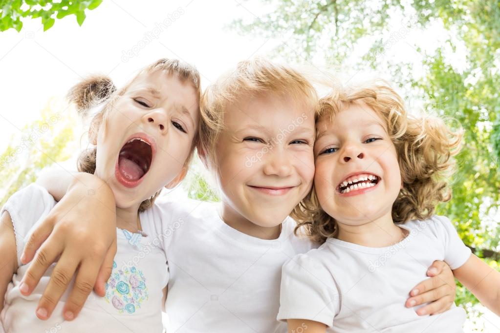 Low angle view portrait of funny children