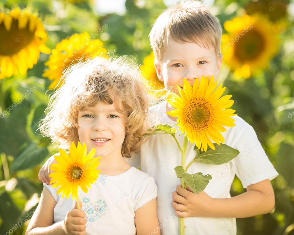 Happy children with sunflower