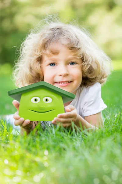 Happy child holding 3d house — Stock Photo, Image