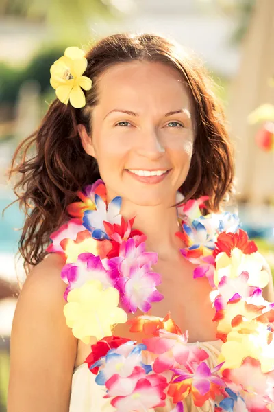 Woman in hawaiian flowers garland Stock Image