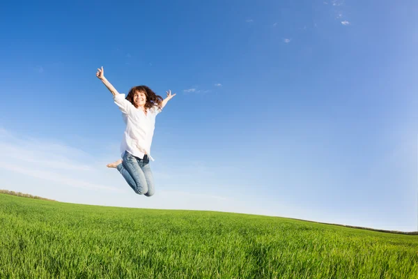 Happy woman jumping Stock Picture