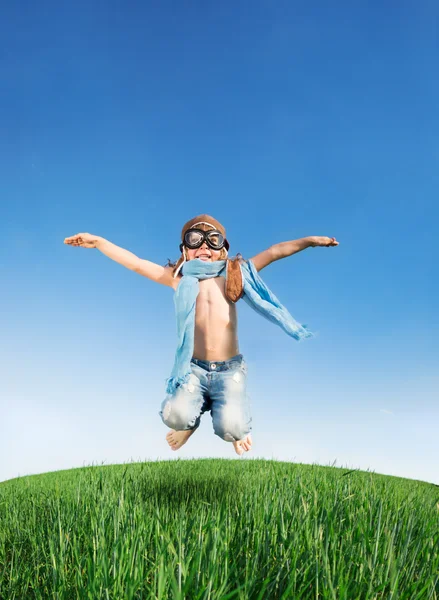 Happy kid jumping outdoors — Stock Photo, Image