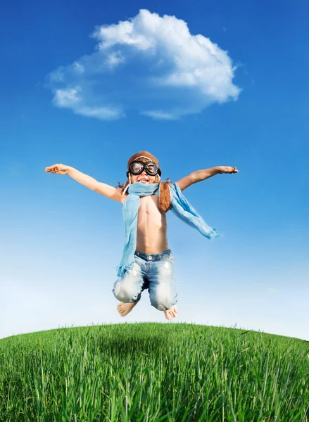 Happy kid jumping outdoors — Stock Photo, Image