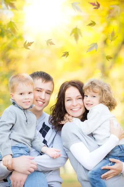 Happy family in autumn park Stock Picture