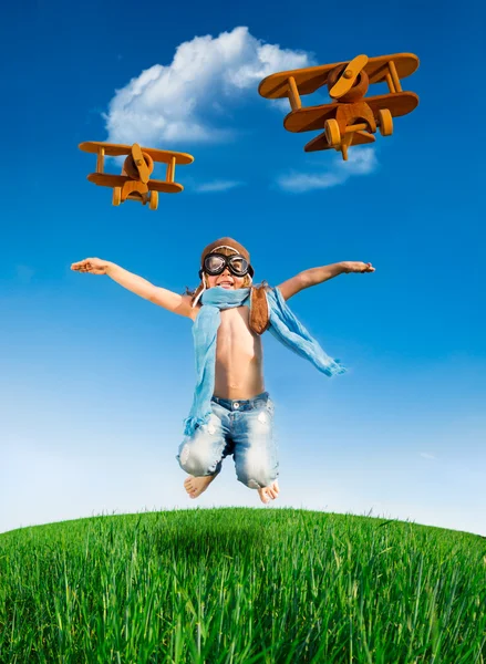 Happy kid jumping outdoors — Stock Photo, Image