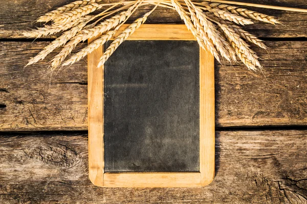 Wheat on old blackboard — Stock Photo, Image