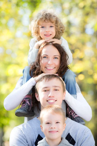 Happy family in autumn park Royalty Free Stock Images