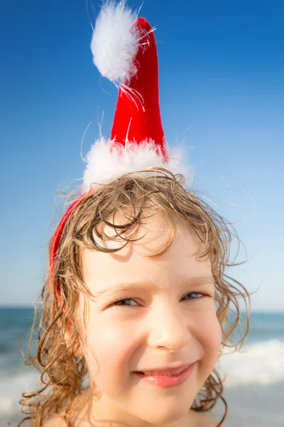 Funny closeup portrait of baby in Santa hat — Stock Photo, Image