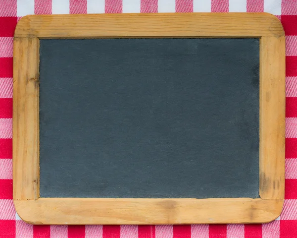 Vintage wooden blackboard on red gingham — Stock Photo, Image