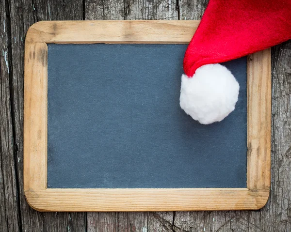 Świąteczna kartka pusta z kapeluszem Santa — Zdjęcie stockowe