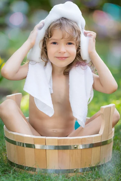 Child bathing outdoors in spring — Stock Photo, Image