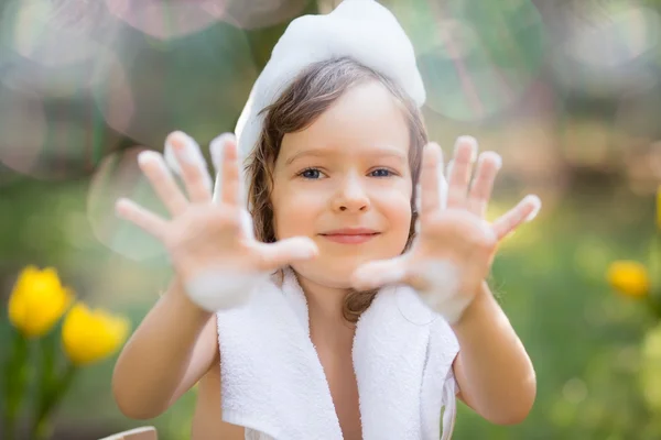 Child bathing outdoors in spring — Stock Photo, Image