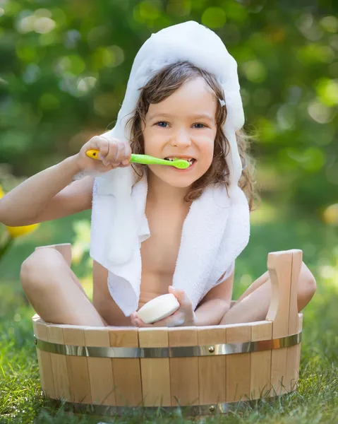 Child bathing outdoors in spring — Stock Photo, Image