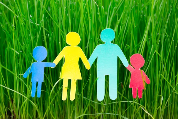 Paper family on grass — Stock Photo, Image