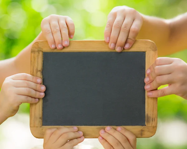 Blackboard blank in hands — Stock Photo, Image