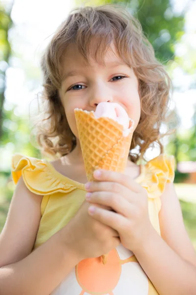 Happy child eating ice cream Royalty Free Stock Images