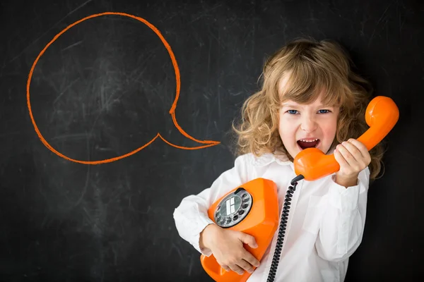 Kid shouting through phone — Stock Photo, Image