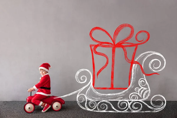 Happy Child Wearing Christmas Costume Kid Riding Toy Car Funny — Stock Photo, Image