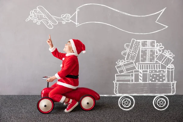 Happy Child Wearing Christmas Costume Kid Riding Toy Car Funny — Stock Photo, Image