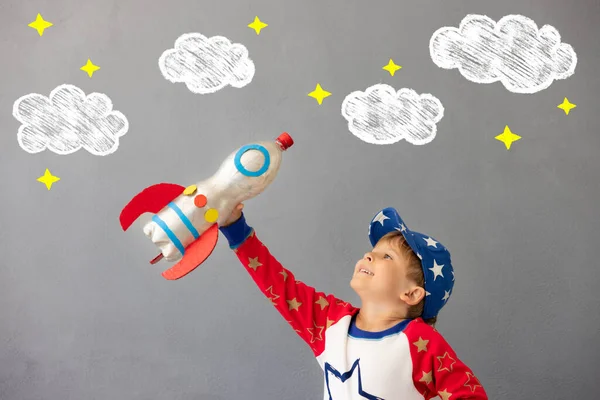 Happy Child Playing Toy Rocket Concrete Wall Background Kid Pretend — Stock Photo, Image