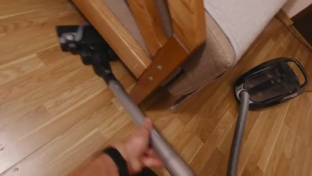 Vacuuming Under The Sofa — стокове відео