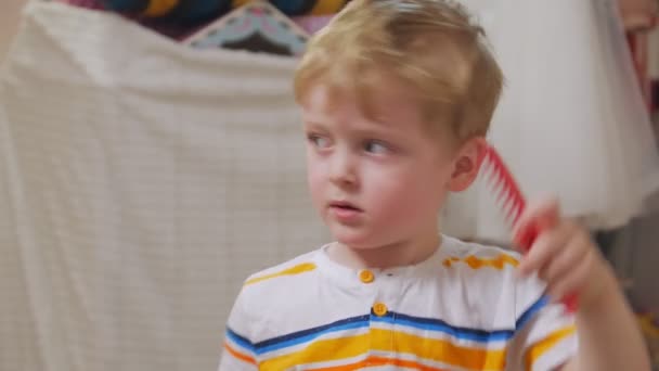 Boy Combing And Having Fun — стоковое видео