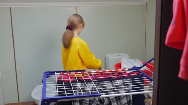 The Girl Hangs Wet Clothes — Stock Video