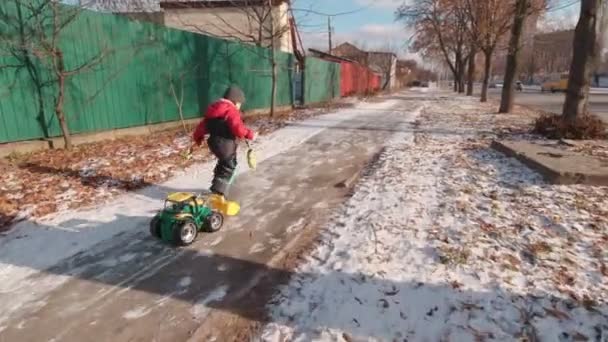 Boy Running On Winter Sreet Slow Motion — Stock video