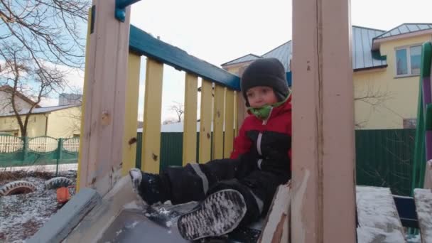 The Boy Slides On The Slide Slow Motion — Stock video