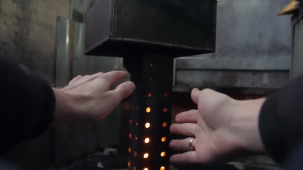 Man Warming Hands By The Flame — Stock video