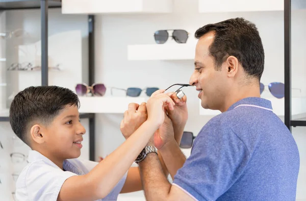 Indian Father Son Choosing Eyeglasses Optics Store Family Buy Glasses —  Fotos de Stock