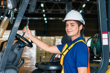 Female worker on forklift, Manual workers working in warehouse, Worker driver at warehouse forklift loader works